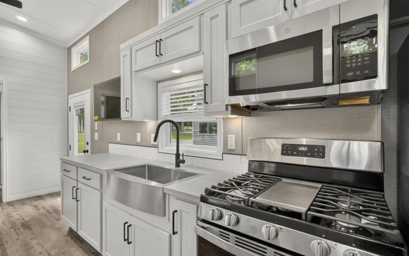 a kitchen with white cabinets