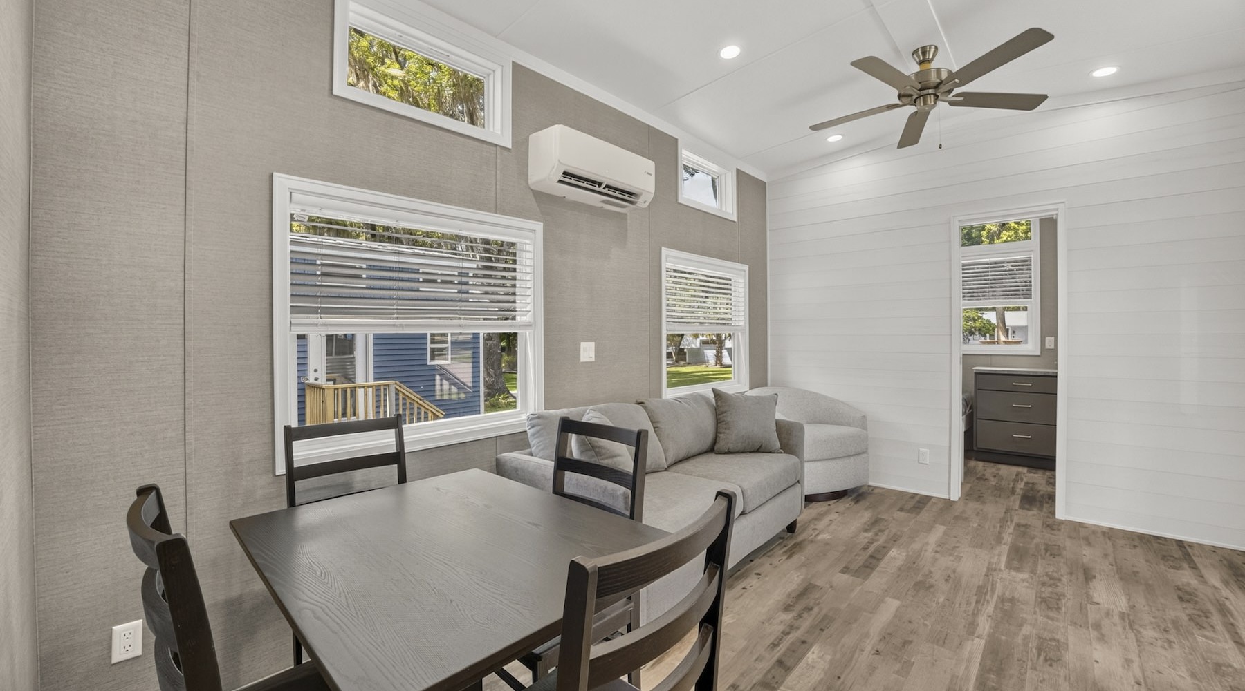 living room with furniture ceiling fan and hardwood floors