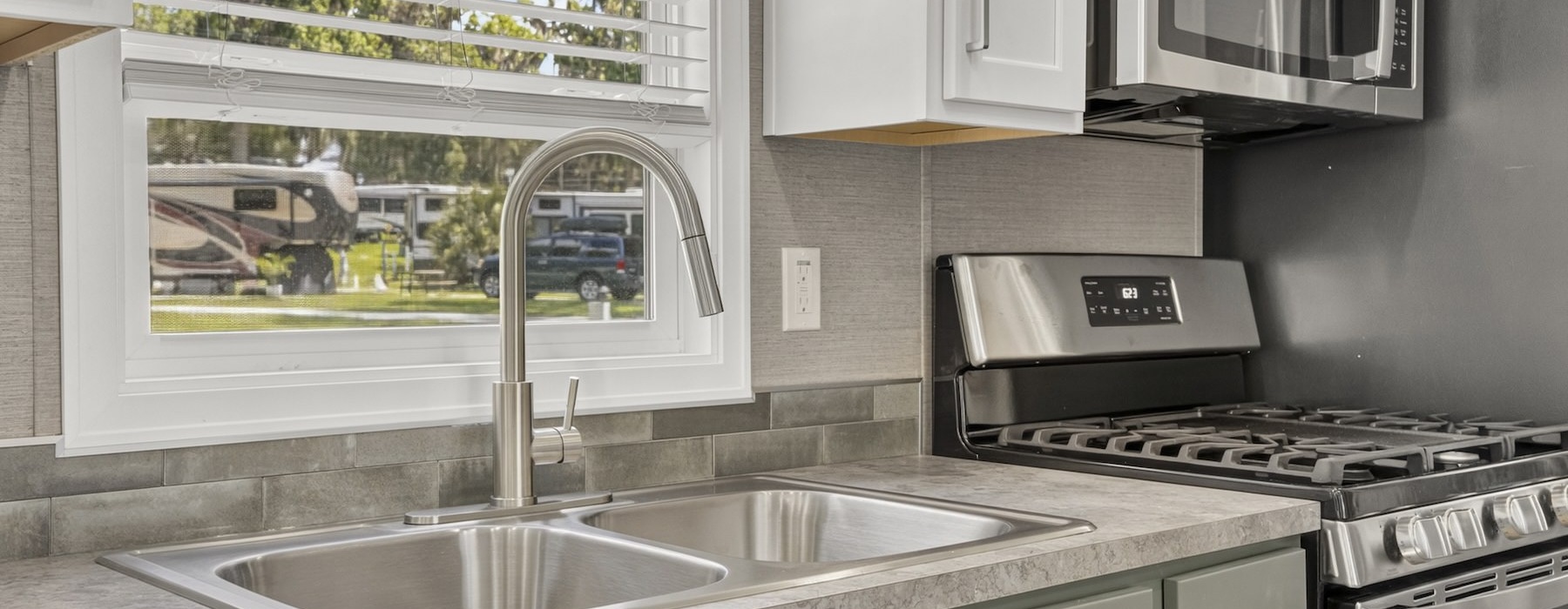 a kitchen with a sink and a window