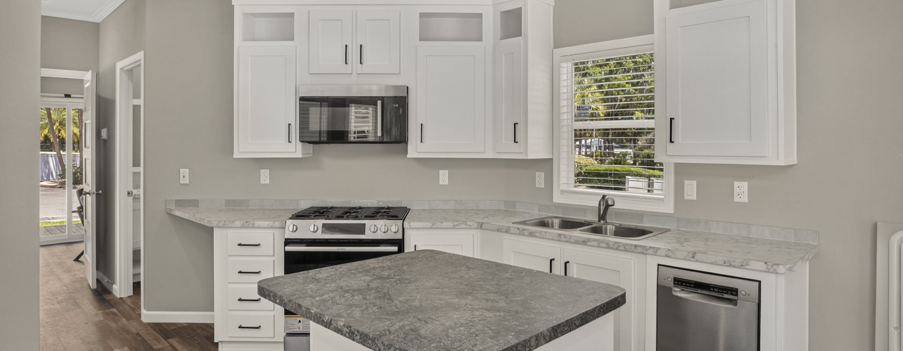 a kitchen with white cabinets