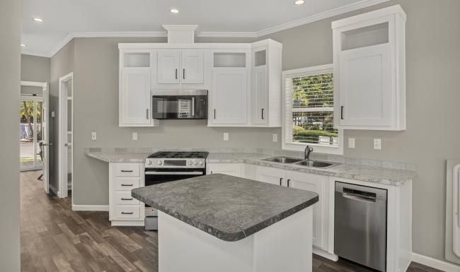a kitchen with white cabinets